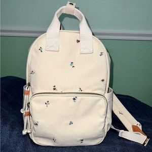 Corduroy backpack with embroidered flowers